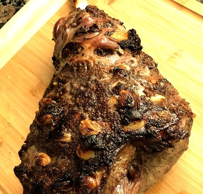 A leg of lamb is roasted with baby potatoes and carrots to make a delicious meal without too much work.
