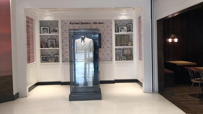 Harland Sanders exhibit near KFC entrance