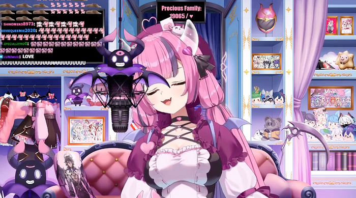 Vtuber Ironmouse sits in front of a room filled with YTuber memorabilia and sings into a demonic-themed microphone while a Twitch chat comments on the left side of the screen.