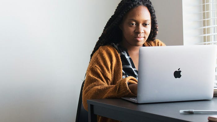 working on a laptop from the comfort of their own home.