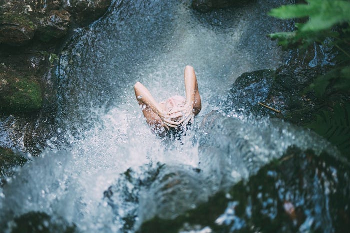 Bathing under a Waterfall