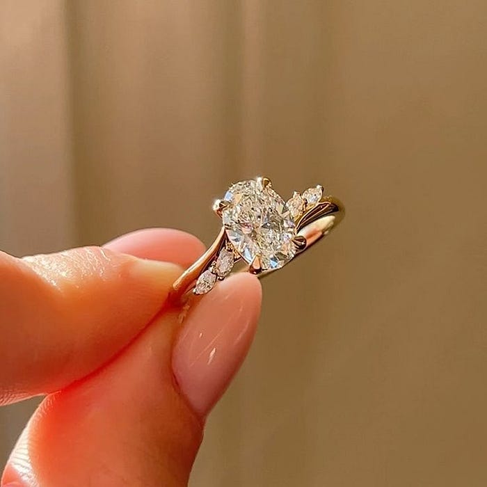 Customer reviewing custom jewelry design on screen, reflecting emotional connection, personalization trends, and modern jewelry buying behavior.