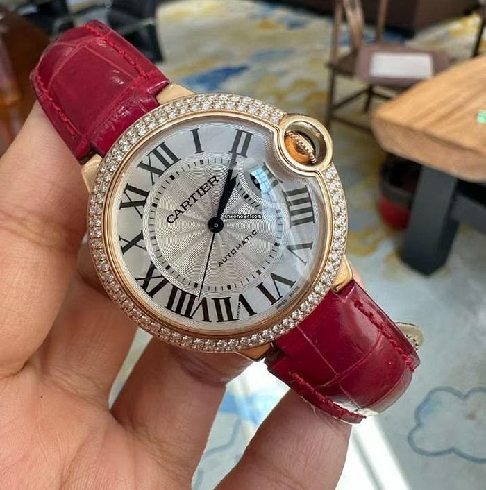 Ballon Bleu de Cartier watch featuring rounded case and signature blue sapphire crown design