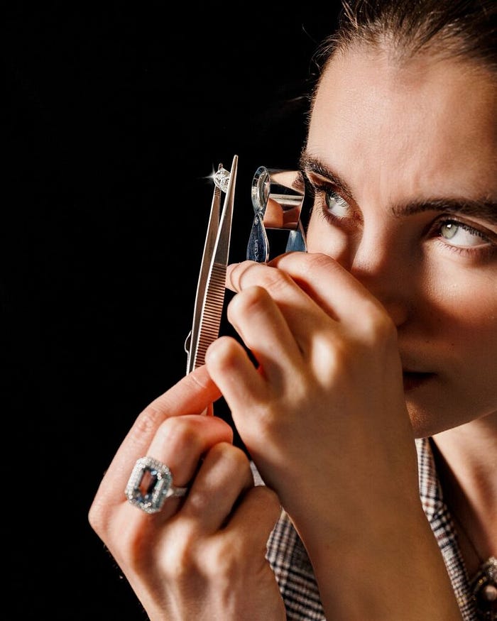 Buyers examining diamonds and colored gemstones for sourcing at an international jewelry exhibition – The Jewelry Gossips