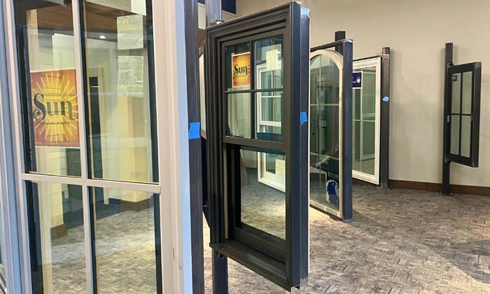 Large showroom window displays showing a variety of window options available.