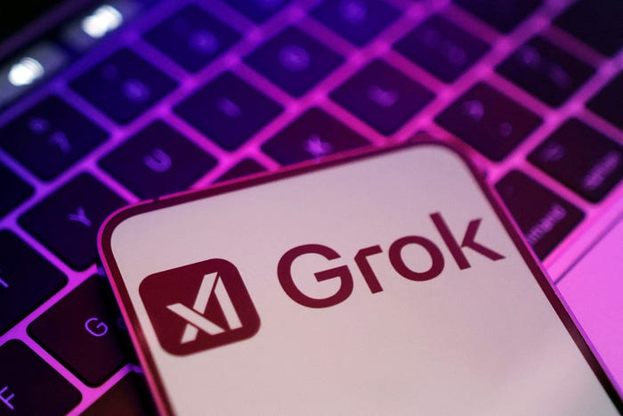 MacBook keyboard with Grok-style AI imagery in the background