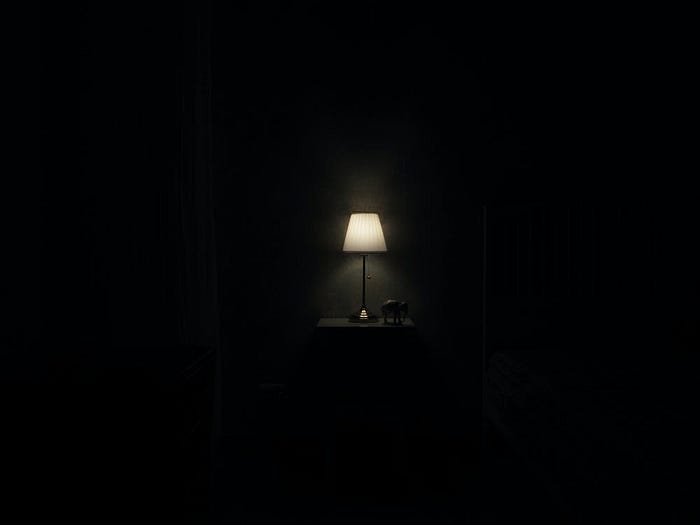 lamp-shade in a dark room