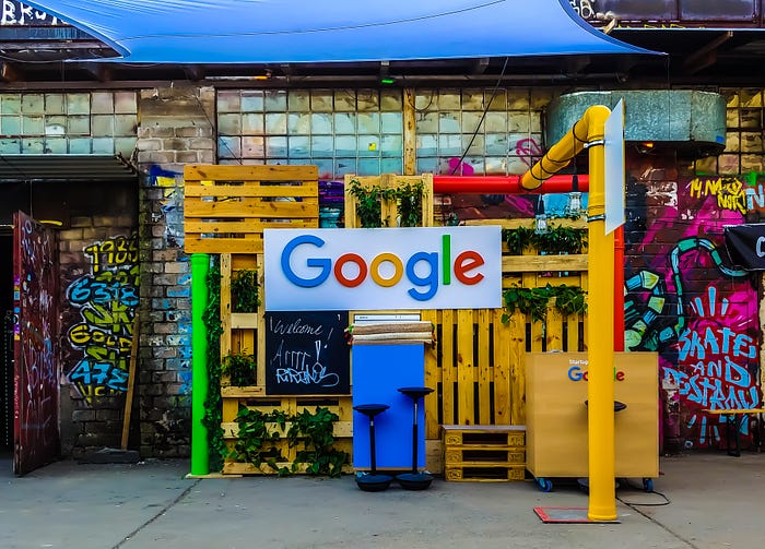 Google logo on a dirty fence