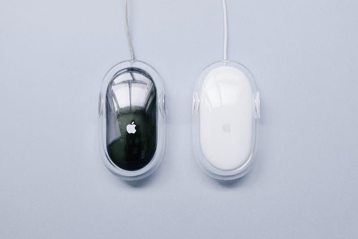 A black and white Apple pro mouse.