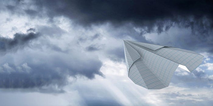 Paper glider in the sky.