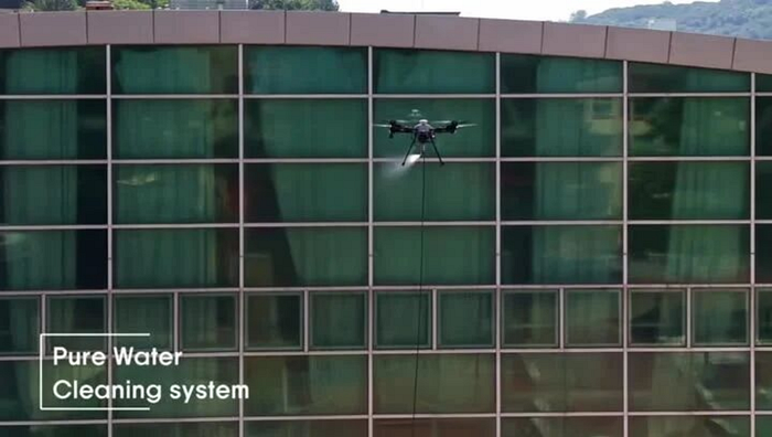 JIUSI D15R drone cleaning glass and metal building facades at Myongji College in South Korea
