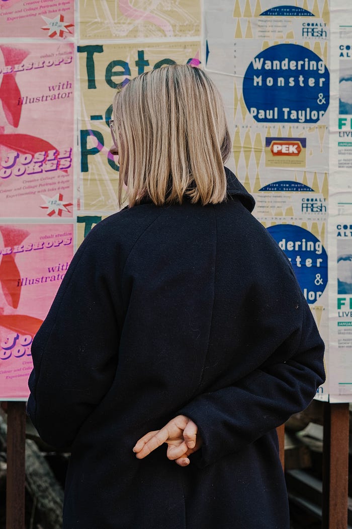 A young white woman crosses her fingers behind her back. Because she is young and white, this clearly cannot signify any mischief.