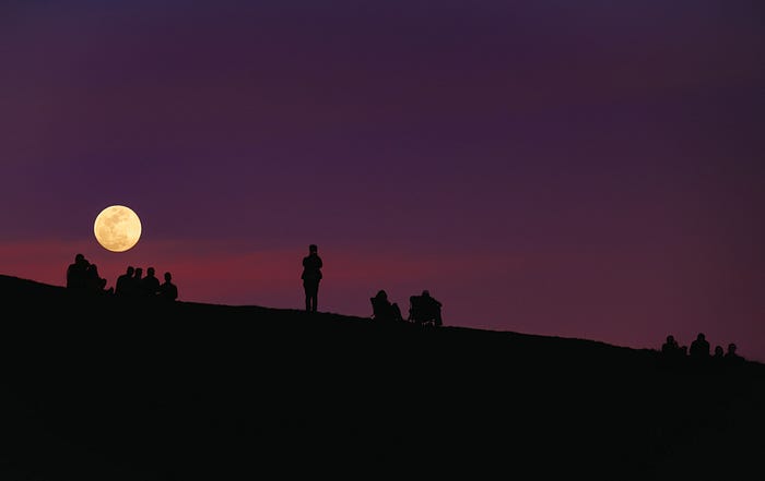 Unsplash color photo by Todd Diemer shows golden full moon on the left in a deep purple sky with sihouettes of people watching from a hillside. Original says Mount Tamalpais, US, March 12, 2017. https://unsplash.com/photos/x9TZjFdvr0Y