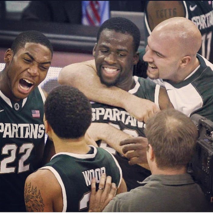 Anthony Ianni giving hug to Draymond Green.