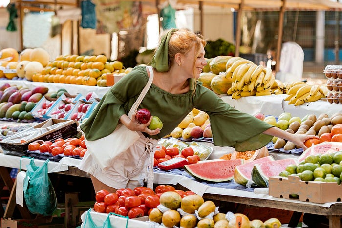 A woman shopping for healthy food at the market.