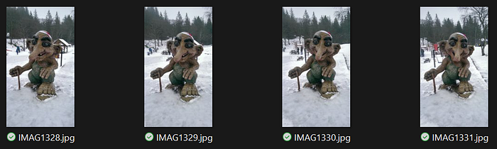 Four input images for a photogrammetry and AI 3D reconstruction test, showing a troll statue in a snowy environment from slightly different angles.