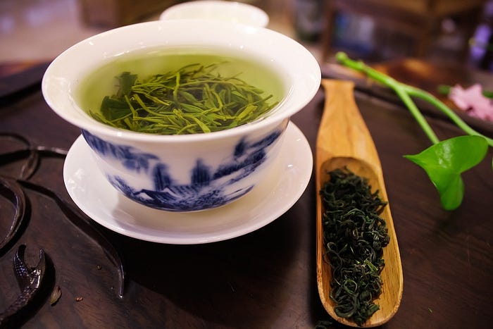 Green tea in a white cup