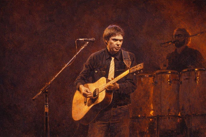 Neil Young playing acoustic guitar