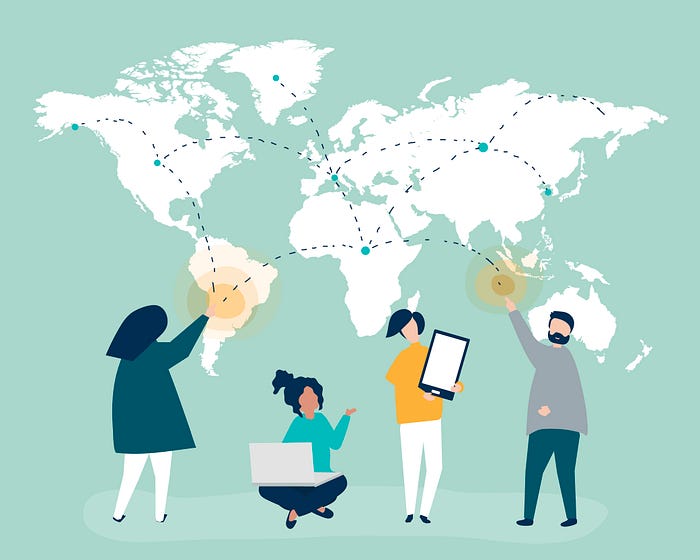 Four employees organizing company locations around the world using a world map and electronic devices.