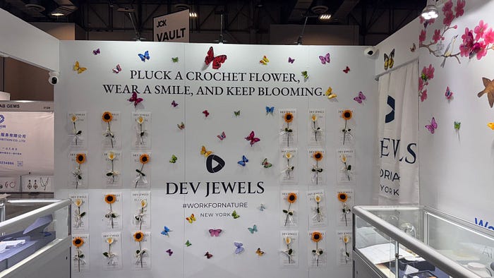 Creative experiential booths at JCK Las Vegas showcasing themed jewelry brand displays