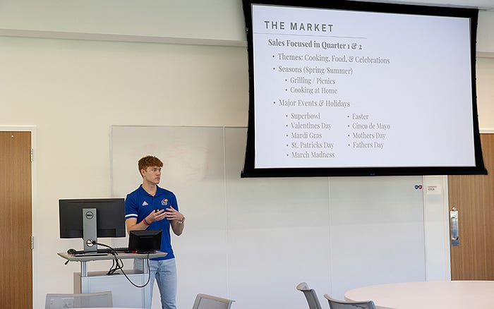 Anderson presents to a crowd during the 2023 Startup Jayhawk Reverse Pitch Competition.