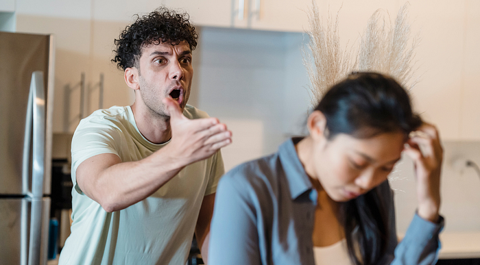 man complaining at exhausted woman