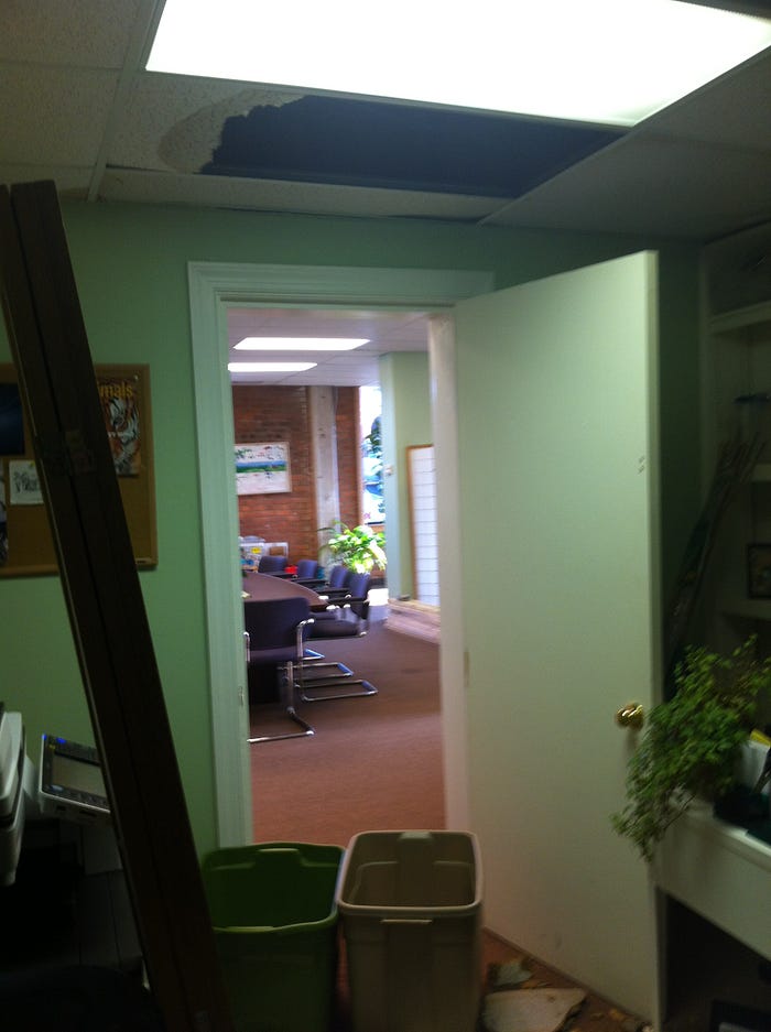 Hole in an office ceiling for a leaky business model