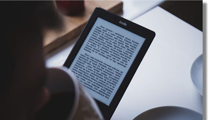 How to Make Money with PLR Ebooks A laptop with a stack of books and dollar bills on the screen, representing making money with PLR ebooks