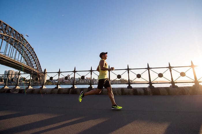 A man running to loose belly fat.