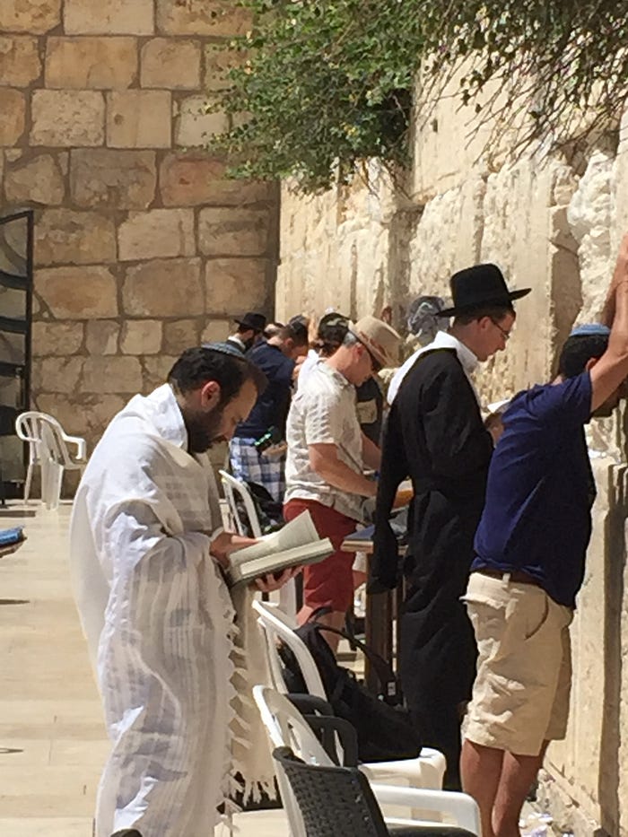 People praying at the Western Wall in Jerusalem.