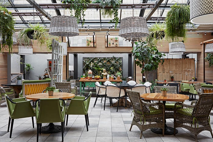 The light-filled atrium cafe called The Garden in the centre of the Kimpton Charlotte Square. Photo courtesy of Kimpton. Story by Laura Metze.