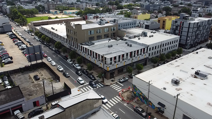 Aerial drone view of Billy Penn Studios, a historic industrial campus in Olde Kensington, Philadelphia, now home to creative studios and unique event venues including the Glass Annex, Alloy Room, and Alloy Loft.