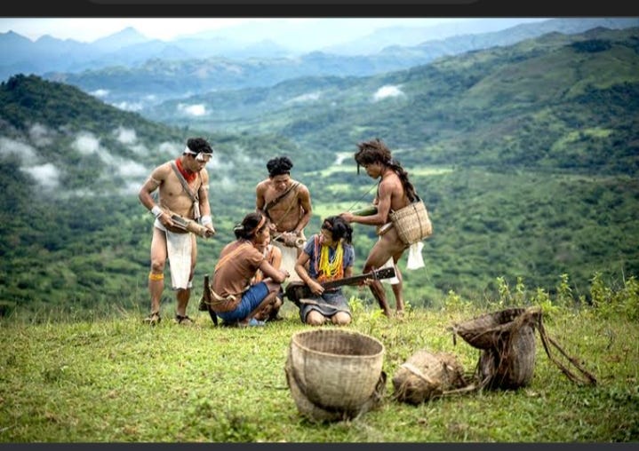 (A photo of Mangyan tribe performing a primitive song) by