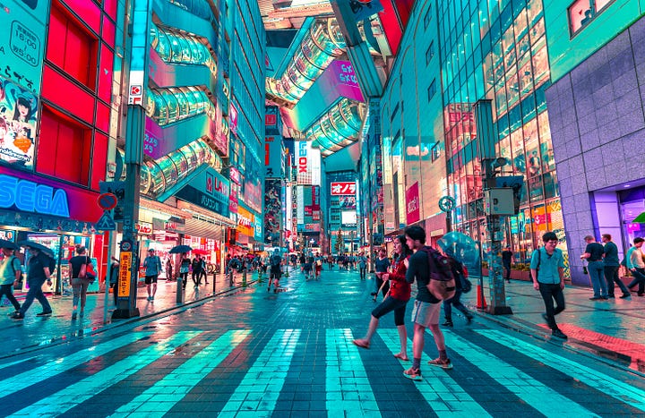 A bird's-eye view of a bustling, complex city intersection at night, symbolizing the interconnectedness of societal systems.