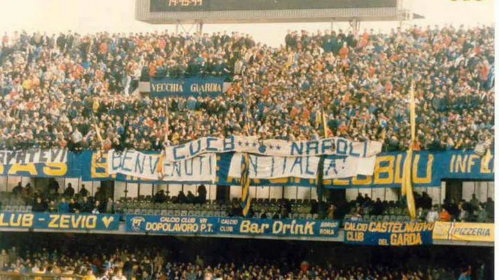 Banners displayed by fans of Hellas Verona: left - “Wash yourselves;” center - “Welcome to Italy”