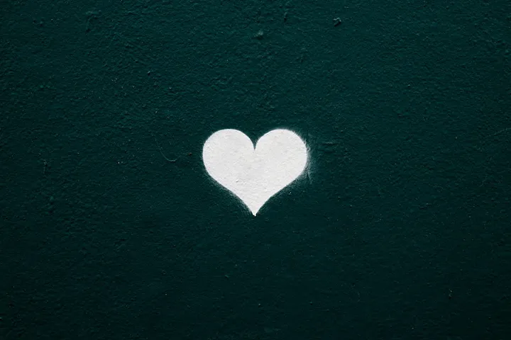 a heart with a deep green background