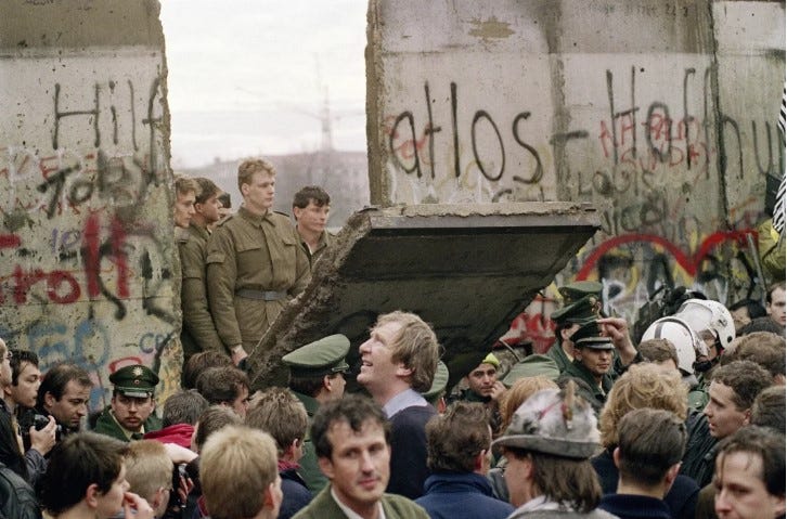 Fall of the Berlin Wall by Gerard Malie/Getty Images