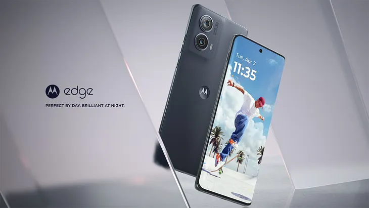 The image shows a Motorola Edge smartphone with a sleek design. The screen displays a vibrant wallpaper of a person skateboarding, highlighting the phone’s display quality. The tagline “Perfect by day. Brilliant at night.” suggests the phone’s features are optimized for any time of day.