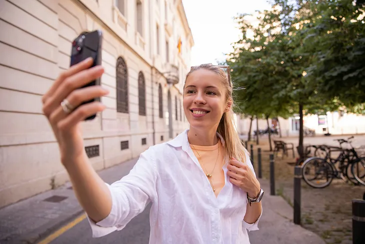 business owner making a Bonjoro review video with her cellphone