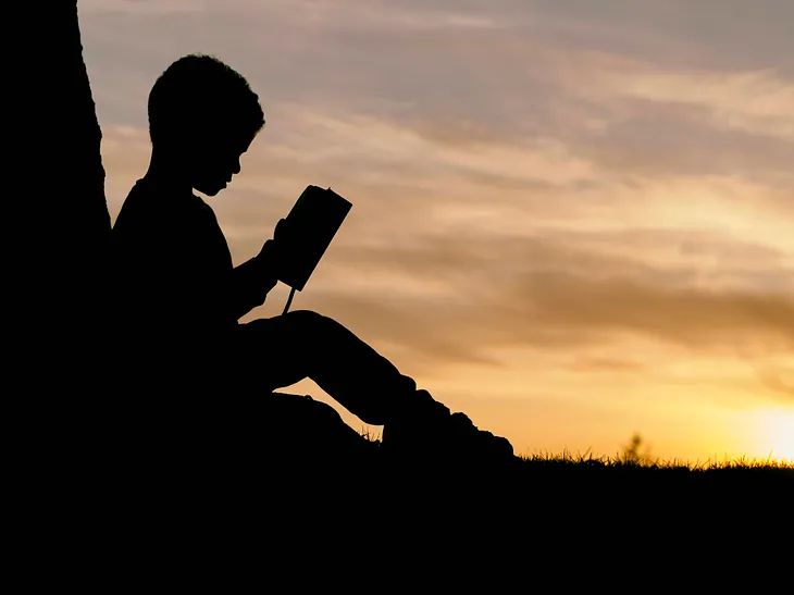 A student sitting and reading