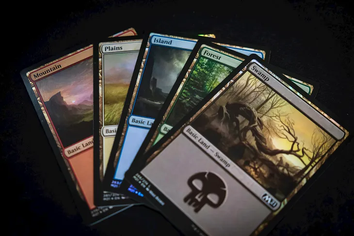 The five basic lands of Magic the Gathering, Mountain, Plains, Island, Forest, and Swamp