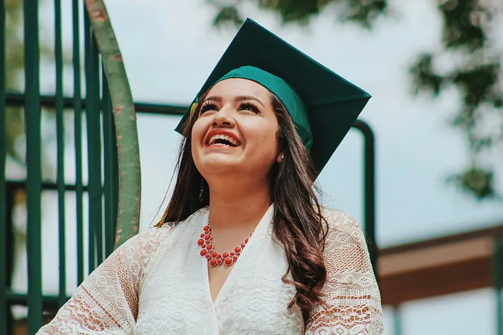 A woman celebrating her university degree