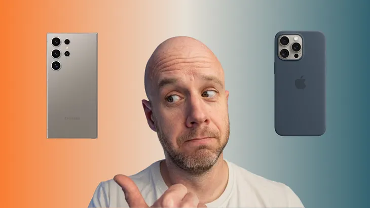 Mark Ellis centre in a white T-Shirt. He is looking to the left where there is a Samsung S24 Ultra phone and on the right is the iPhone 15 in blue. The background is orange, to white to blue gradient.