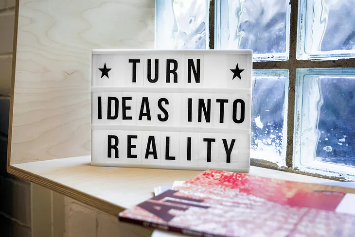 pic shows a sign that says “Turn ideas into reality”