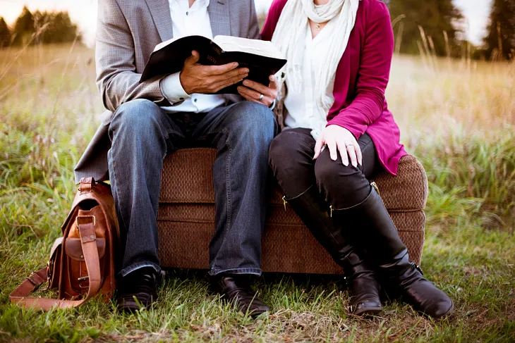 Man and woman reading the Bible