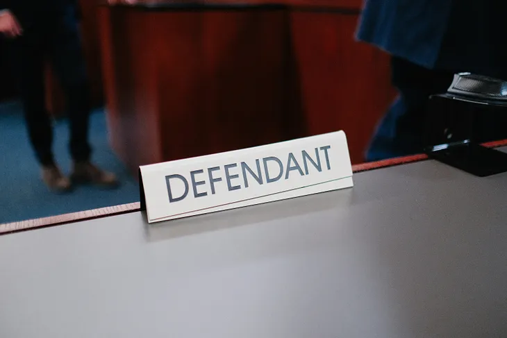 Table sign on the Defendant’s table