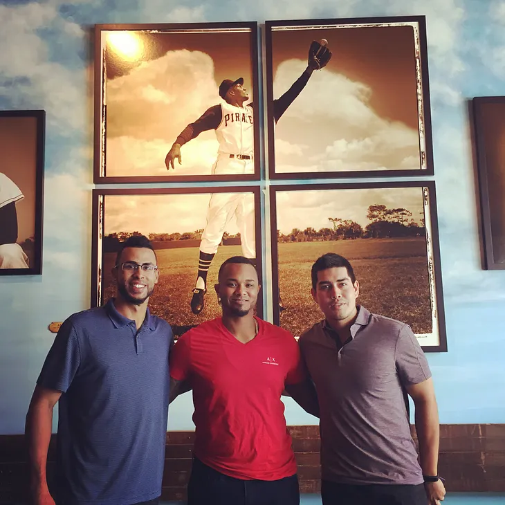 Yadiel Rivera, Martin Maldonado and Ramon Flores pose in front of an amazing photograph of Clemente that Rieder recovered in a dumpster in Puerto. Just one of the many amazing artifacts and stories you'll come across at the museum.