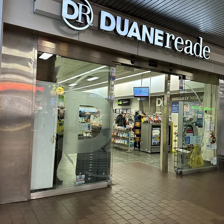 You're drunk, You’re on a train, and you have half a Duane Reade sign