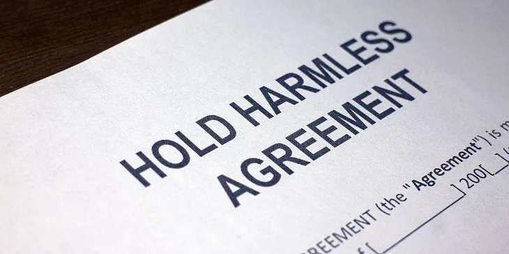 How does a hold harmless agreement work in business