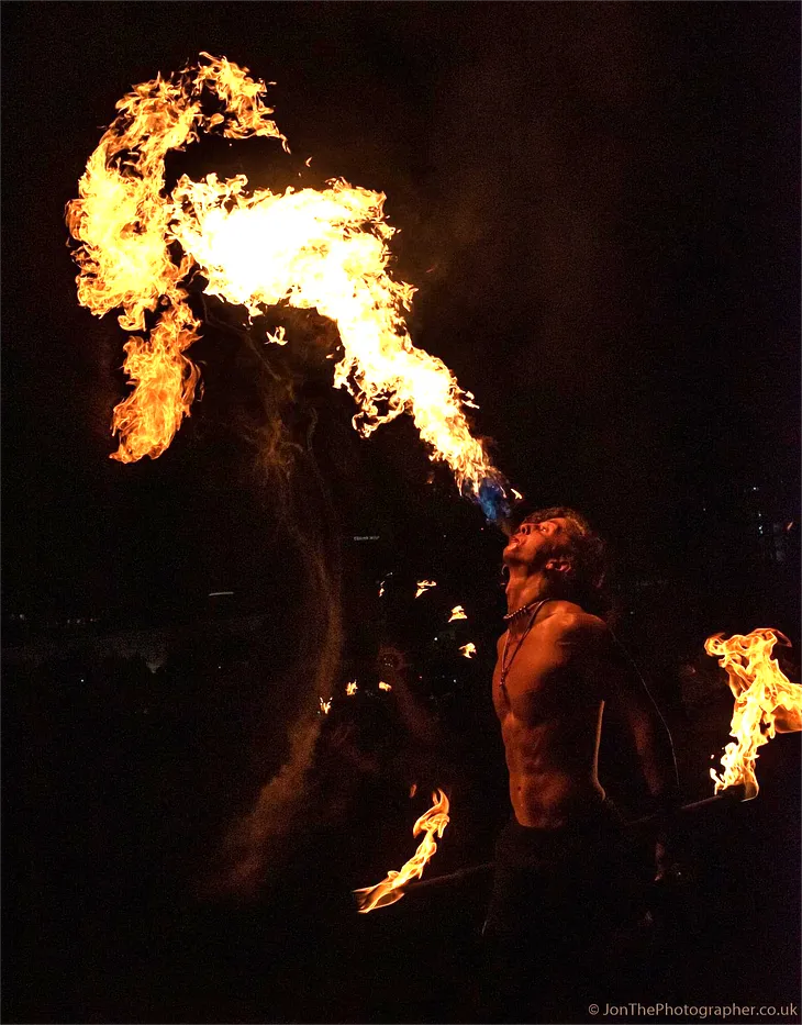 Performer plays with fire